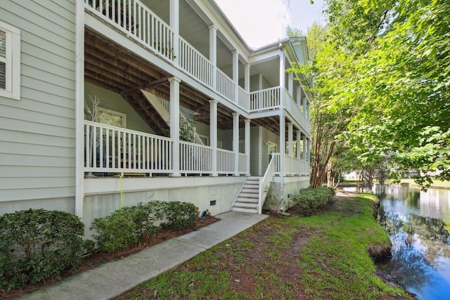 2329 Tall Sail Dr Unit 704D, Charleston, SC 29414 - view of home's exterior featuring stairway and a water view