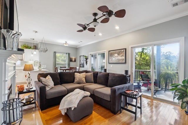 2329 Tall Sail Dr Unit 704D, Charleston, SC 29414 - living area with ceiling fan, light wood-type flooring, ornamental molding, recessed lighting, and a fireplace