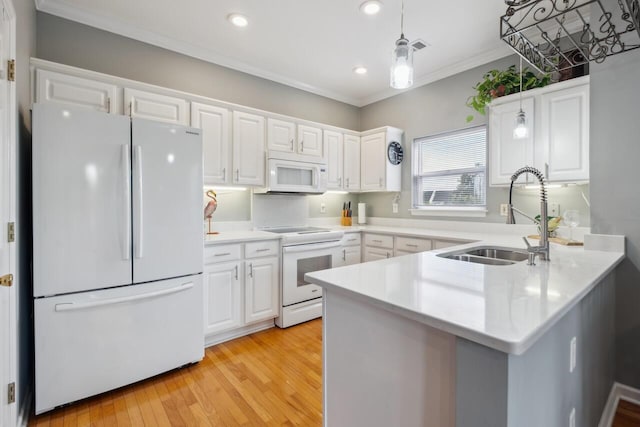 2329 Tall Sail Dr Unit 704D, Charleston, SC 29414 - kitchen with white appliances, white cabinetry, a peninsula, hanging light fixtures, and recessed lighting