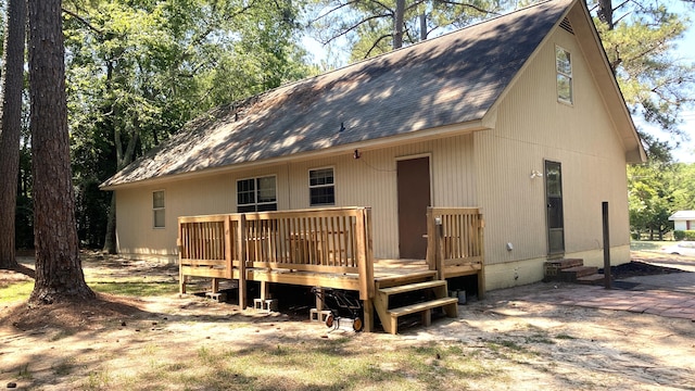 rear view of house featuring a deck