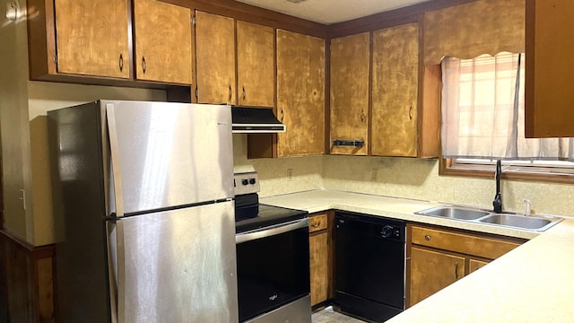 kitchen with sink, exhaust hood, and stainless steel appliances