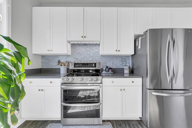 kitchen with white cabinets, stainless steel appliances, and dark hardwood / wood-style floors