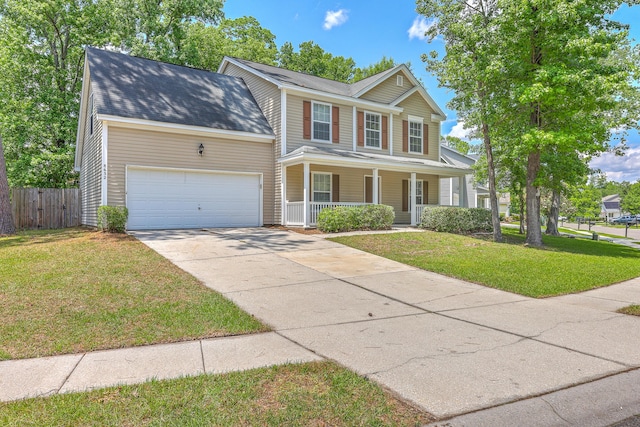view of front of house with fence, covered porch, an attached garage, concrete driveway, and a front yard