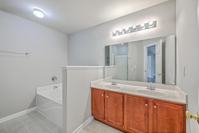 full bathroom featuring baseboards, a bath, double vanity, and a sink