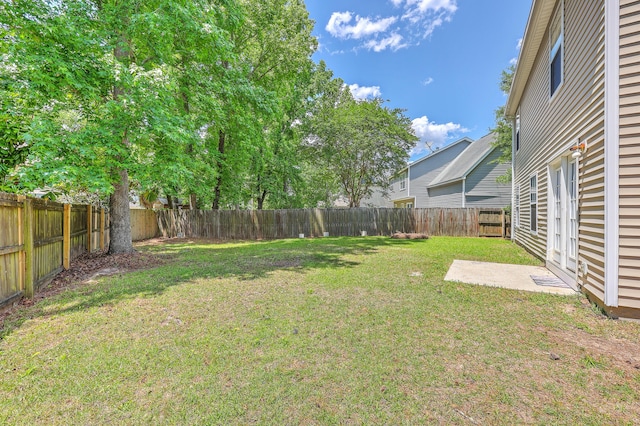 view of yard featuring a patio and a fenced backyard