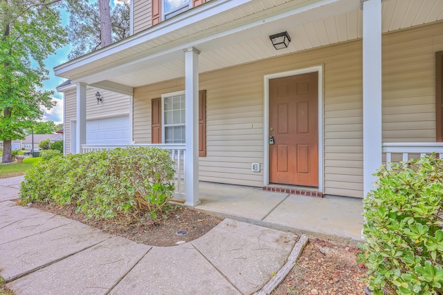 property entrance featuring covered porch