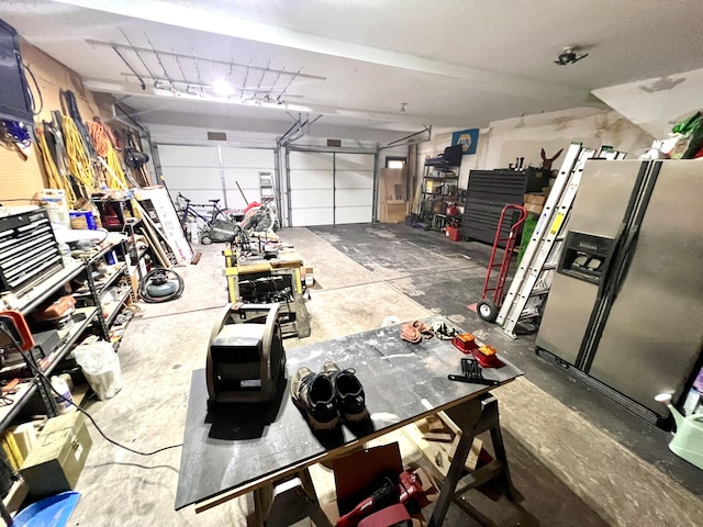 1325 Edward Dr, Moncks Corner, SC 29461 - garage with stainless steel fridge with ice dispenser and a workshop area