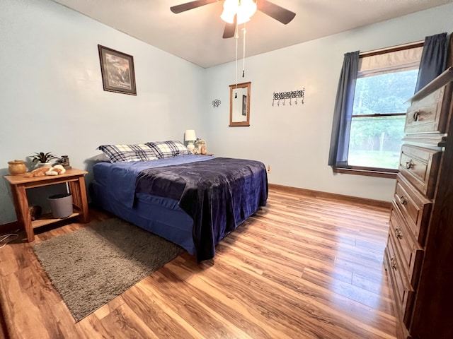 1325 Edward Dr, Moncks Corner, SC 29461 - bedroom with light wood-style floors, baseboards, and a ceiling fan