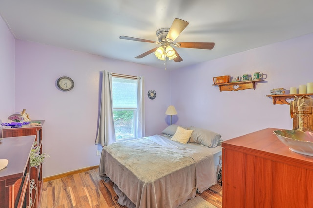 1325 Edward Dr, Moncks Corner, SC 29461 - bedroom featuring light wood-type flooring, ceiling fan, and baseboards