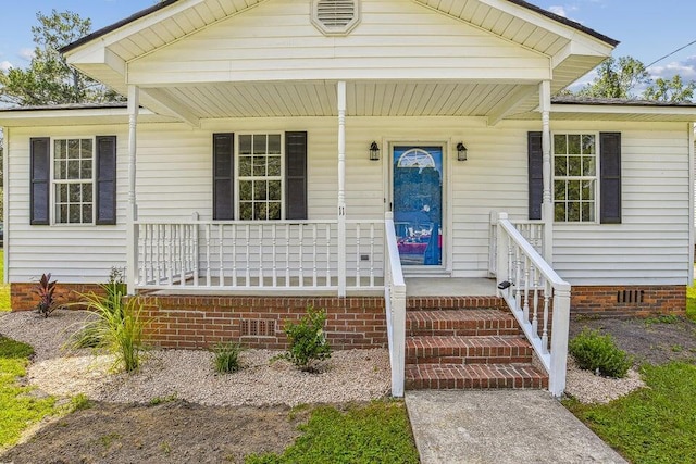 view of front of home with crawl space and covered porch