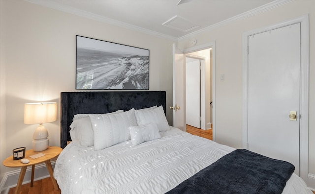 bedroom featuring crown molding and wood-type flooring