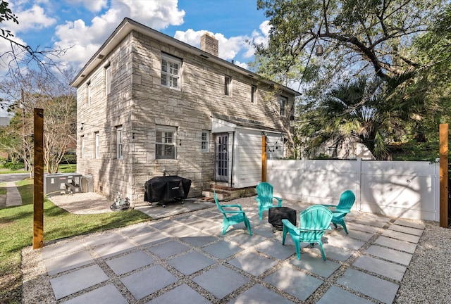 back of property featuring a patio area