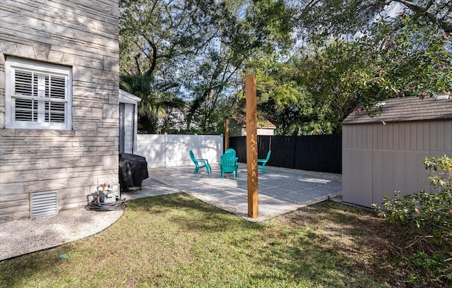 exterior space with a patio area and a storage shed