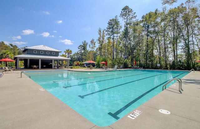 view of swimming pool featuring a patio