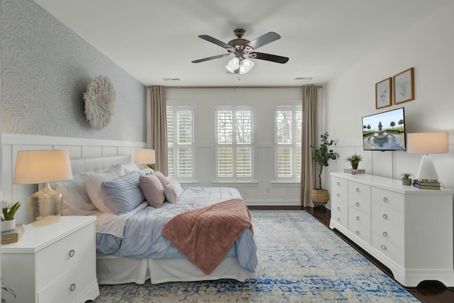 bedroom with ceiling fan and dark hardwood / wood-style floors