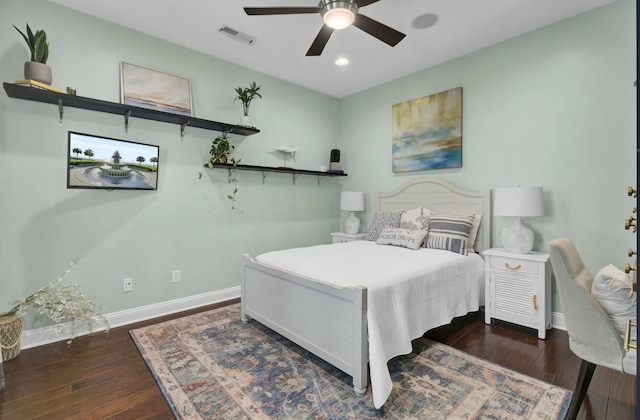 bedroom featuring ceiling fan and dark hardwood / wood-style flooring