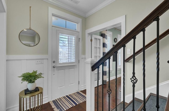 entrance foyer with ornamental molding and wood-type flooring