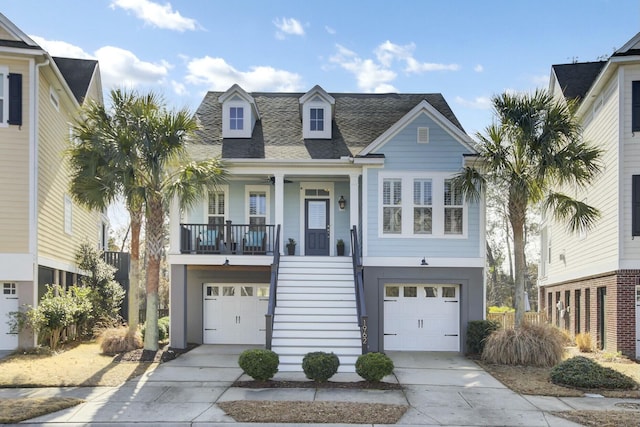 view of front facade featuring a garage and covered porch