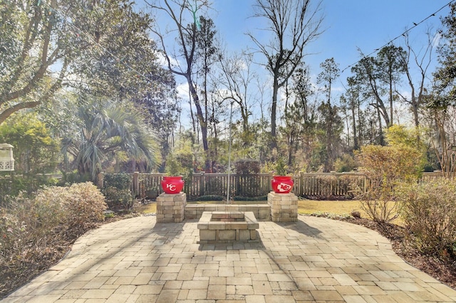 view of patio / terrace featuring an outdoor fire pit