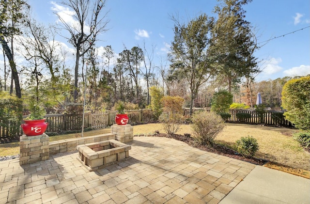 view of patio with a fire pit