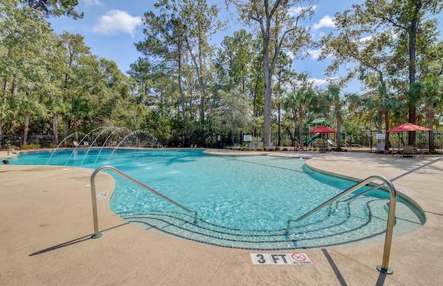 view of pool with pool water feature