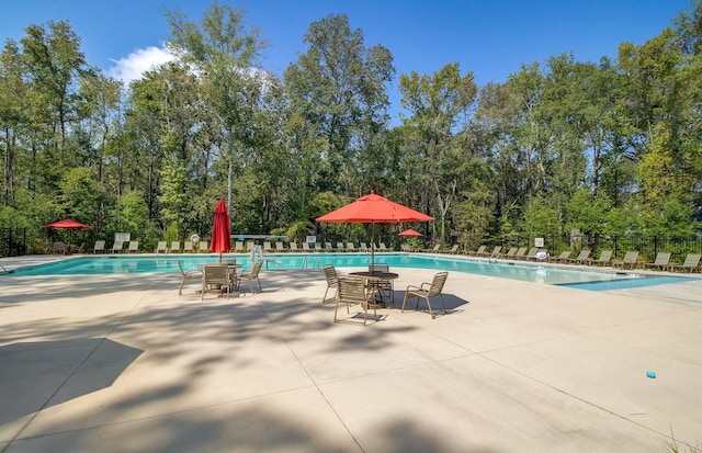 view of swimming pool featuring a patio