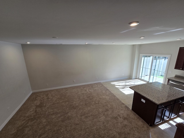 carpeted spare room with recessed lighting and baseboards