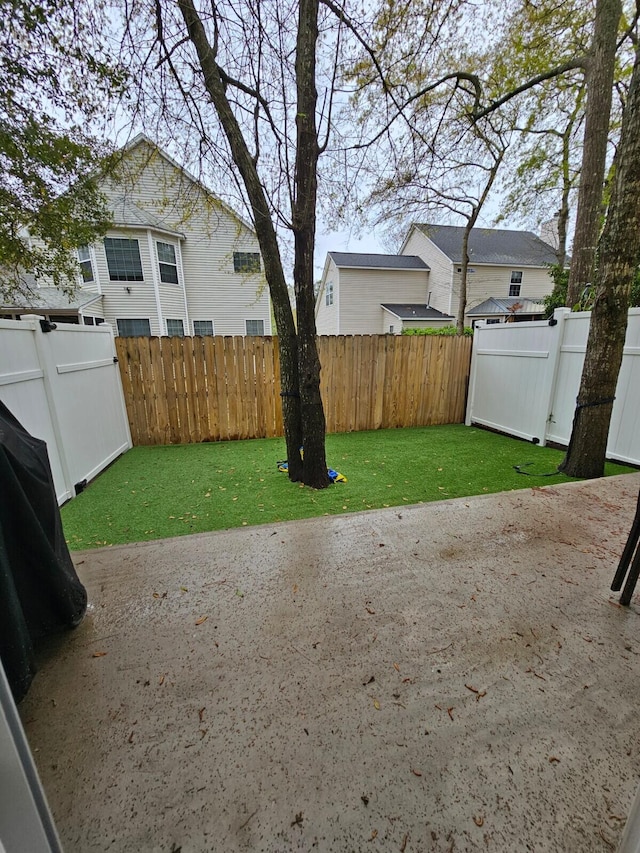 view of yard with a fenced backyard