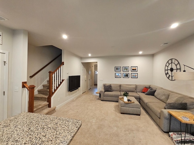 living room featuring recessed lighting, visible vents, light carpet, and stairs