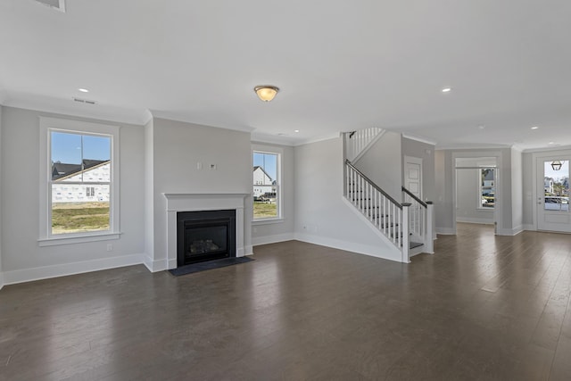 unfurnished living room featuring crown molding and dark hardwood / wood-style floors