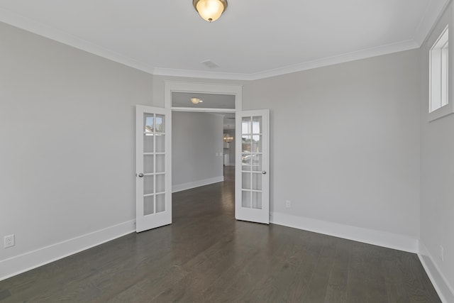 spare room featuring french doors, dark hardwood / wood-style flooring, and crown molding