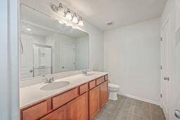 bathroom with toilet and vanity