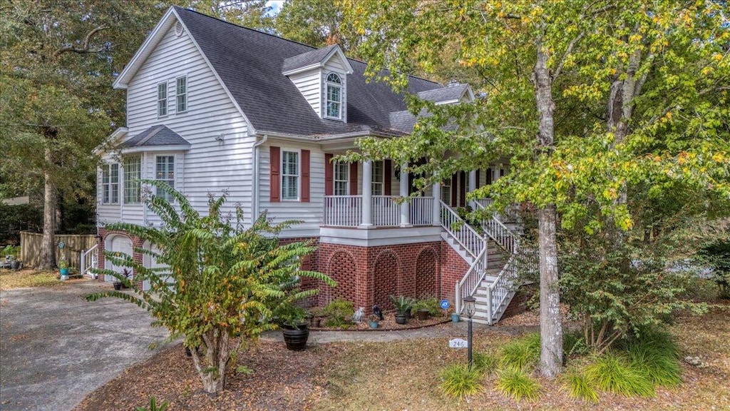 cape cod-style house with a porch