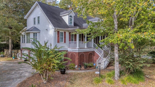 cape cod-style house with a porch