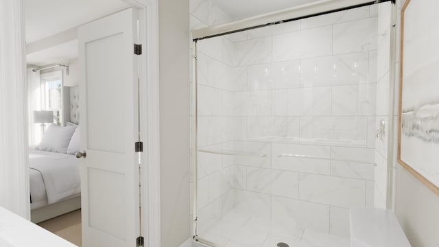 ensuite bathroom featuring a shower stall and connected bathroom