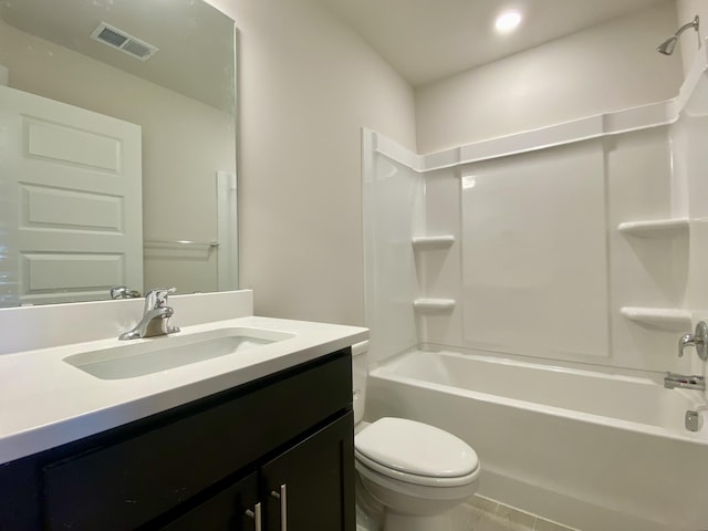 bathroom featuring toilet, visible vents, shower / bathing tub combination, and vanity