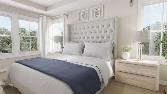 bedroom featuring multiple windows and baseboards