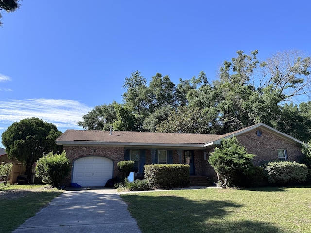 single story home featuring a garage and a front lawn