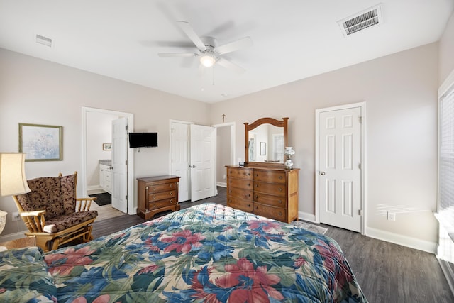 bedroom featuring ceiling fan, dark wood-type flooring, and connected bathroom