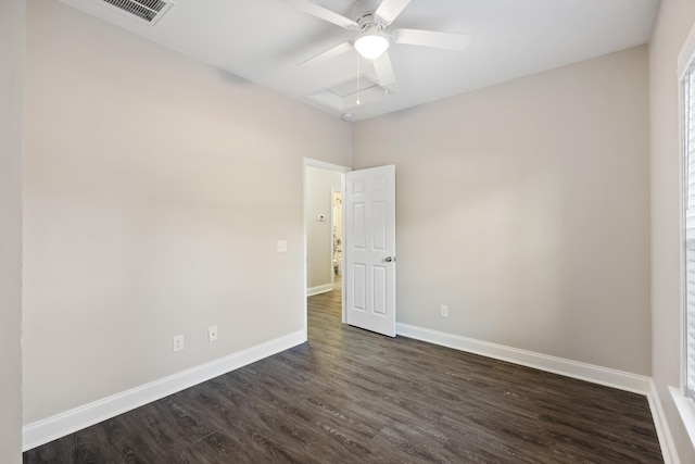 spare room with ceiling fan and dark hardwood / wood-style flooring