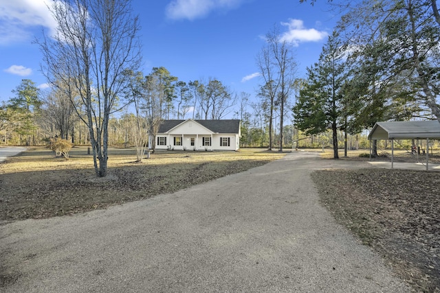 exterior space with a porch and a carport