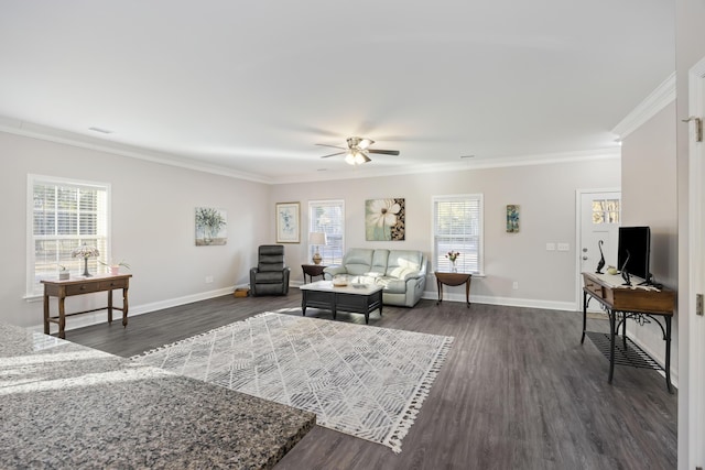 living room featuring dark wood-type flooring, ornamental molding, plenty of natural light, and ceiling fan