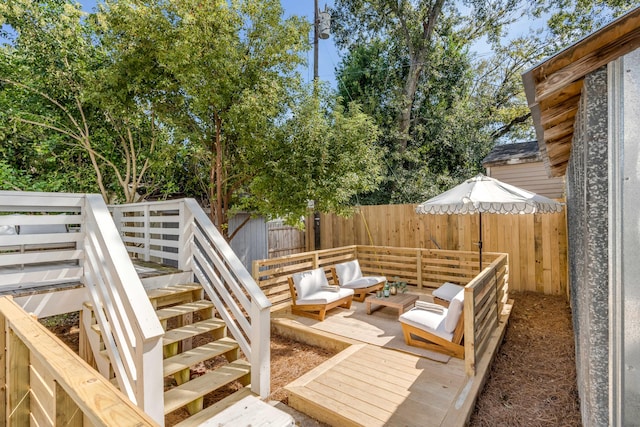 wooden terrace featuring outdoor lounge area