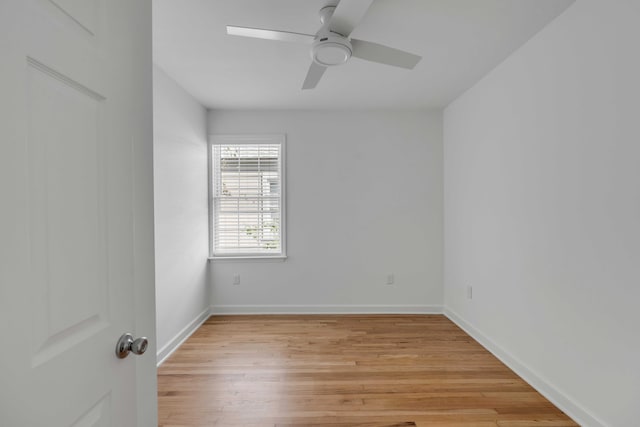 empty room with ceiling fan and light hardwood / wood-style floors