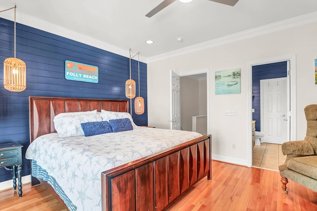 bedroom featuring ceiling fan, light wood-type flooring, baseboards, and ornamental molding