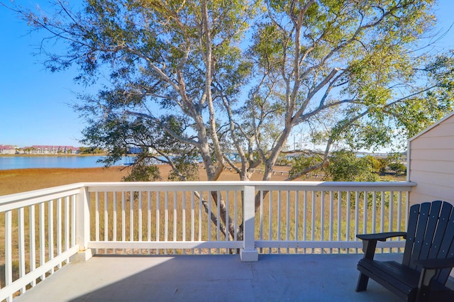 wooden deck featuring a water view