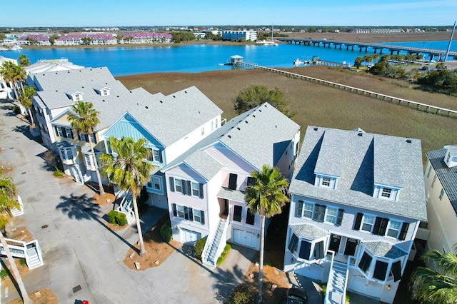 bird's eye view featuring a residential view and a water view