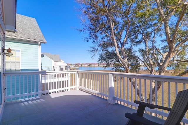 balcony featuring a water view