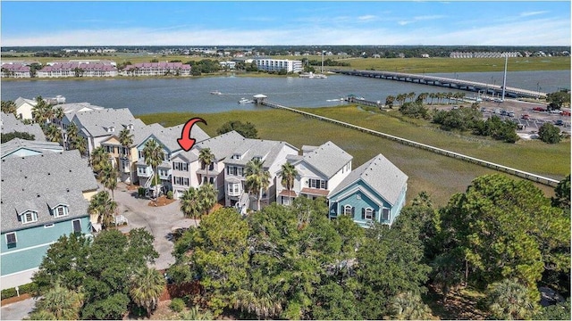 birds eye view of property featuring a water view and a residential view