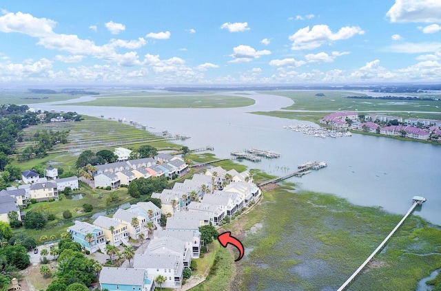 birds eye view of property featuring a water view and a residential view